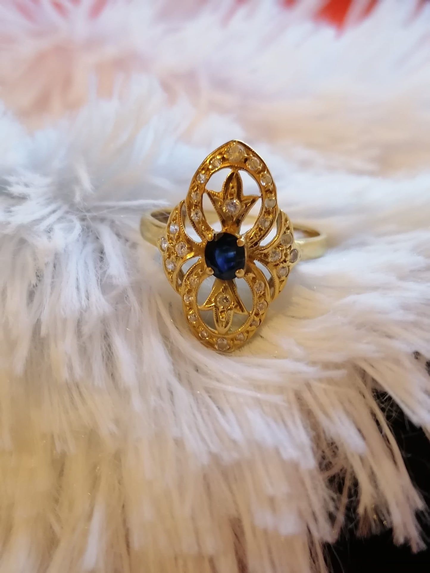 Gold ring, diamonds and intense blue sapphire